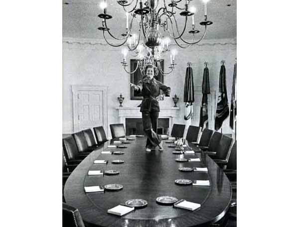 First Lady Elizabeth Ford standing on a table in the white house